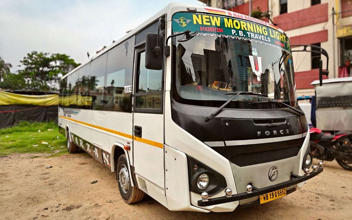 P.B. Travels Force Traveller group tour coach in Kolkata