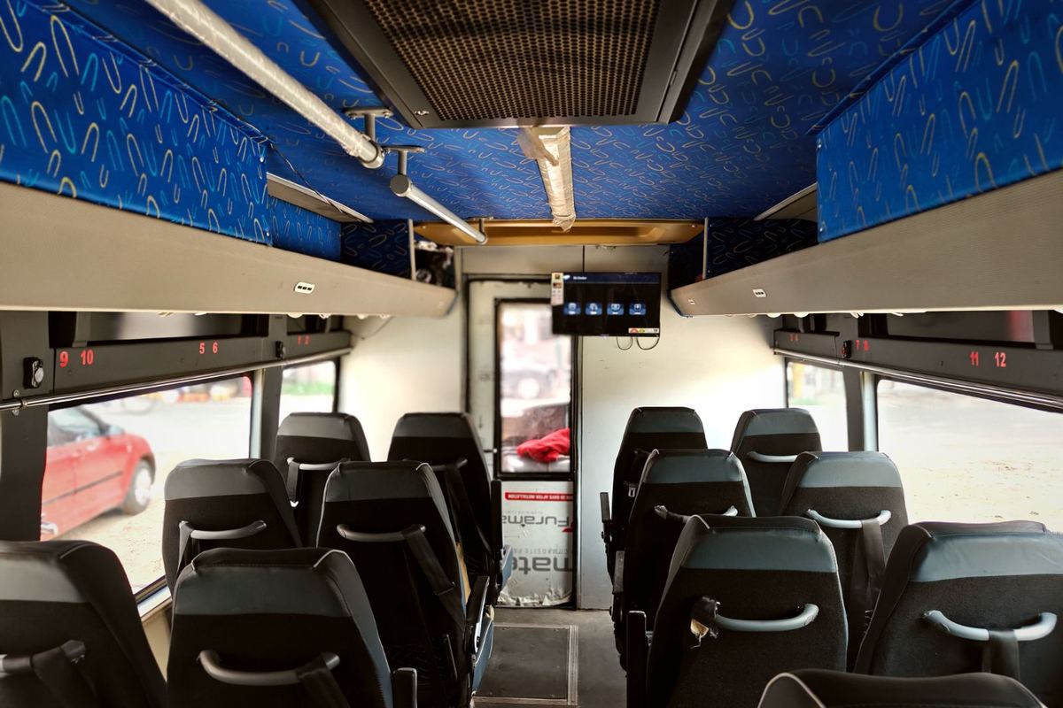 Interior of a P.B. Travels coach with reclining high-back seats